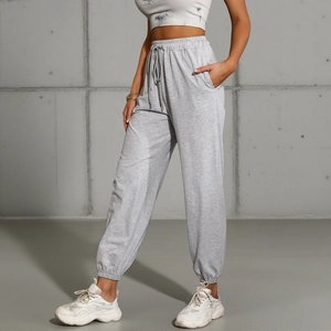 Women's light grey high waist jogger pants with adjustable drawstring and ribbed cuffs
