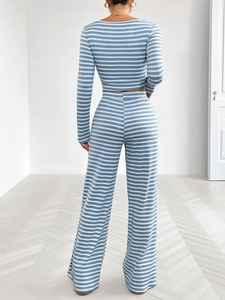 Detail view of the blue and white horizontal stripes and ribbed knit fabric on the back