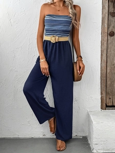 Detail of striped bandeau jumpsuit with straw belt and wide-leg trousers in summer style