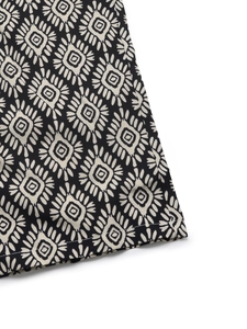 Close-up of bohemian sun-flower print on fabric with high-quality stitching details