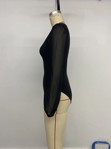 Detail view showing black mesh patchwork sleeves on a slim fit women's bodysuit