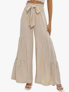Detailed view of high waist tiered ruffles and elastic smocked waistband with matching fabric belt