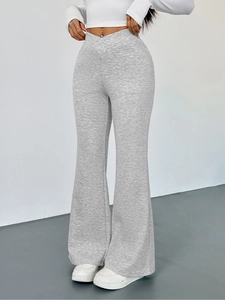 Slim fit high-waisted heather grey flare pants with a unique crossover V-waistband