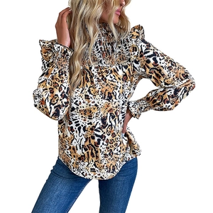 Women's leopard print long sleeve shirt with high smocked neck and ruffle shoulder details