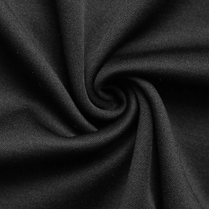 Detail of black mesh knit fabric showing fine grid texture and soft pleated drape