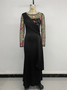 Detail of floral mesh embroidery and pleated bodice on a vintage black long dress