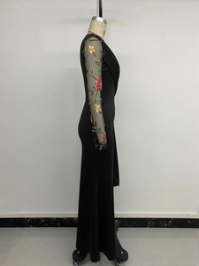 Detailed close-up of semi-transparent mesh sleeves with vibrant floral rose embroidery