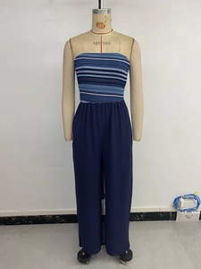 Detail showing blue striped knit bodice and wide-leg trousers on a display mannequin