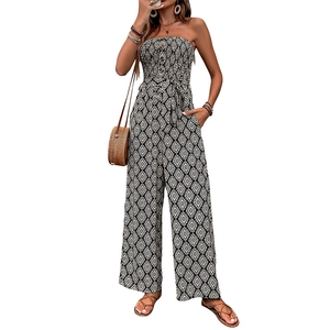 Bohemian strapless wide-leg jumpsuit with black and white geometric print and waist tie