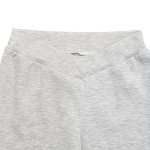 Detail view of light grey crossover V-waistband on women's athletic flare pants