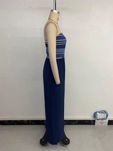 Detail of high-waisted navy blue wide-leg jumpsuit with striped tube top design