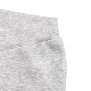 Detail shot of the V-waist and heather gray knit texture on these flared casual pants