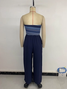 Rear view of strapless jumpsuit featuring striped bodice and elastic high waist wide legs