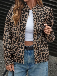 Detail of leopard print jacket showing button closure and elastic cuffs on a model
