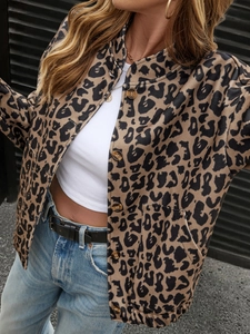 Detail of leopard print jacket showing collar design, buttons, and large front pockets
