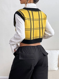 Rear view of a yellow and black checkered knit vest with ribbed edges and cropped fit