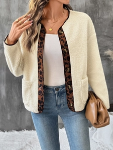 Close-up of leopard print trim on women's plush fleece cardigan with button detail
