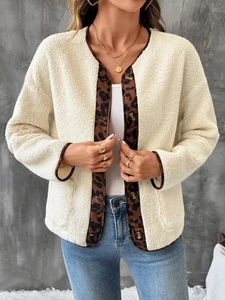 Detail of plush fleece cardigan with leopard print trim and coffee brown buttons