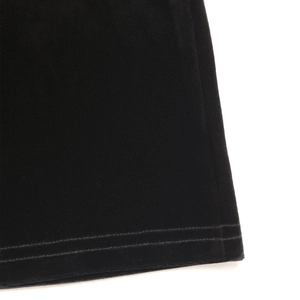Detailed close-up showing high-quality double-needle stitching on velvet trousers fabric