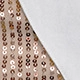 Detailed close-up of metallic sequins in gold and bronze on fabric for trendy shirt