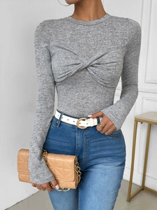 Slim fit long sleeve knit top in heather grey featuring a twist front knot design