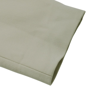 Detailed close-up of light beige blazer sleeve fabric with premium woven texture