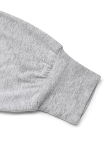 Detail shot of grey heather knit fabric showing ribbed elastic cuffs and stitching quality