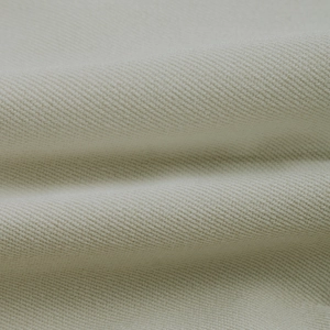 Close-up macro view of beige twill fabric texture for casual commute blazer jacket