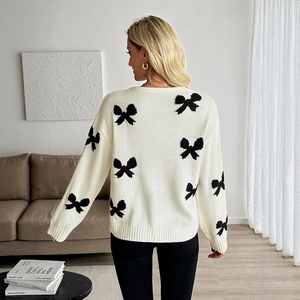 Damen-Strickpullover in Creme mit schwarzem Schleifen-Jacquard-Design und Rippstrickbündchen