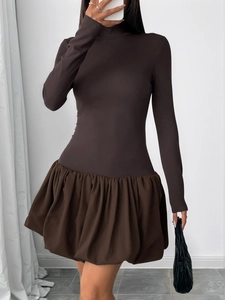 Detailed view of dark brown long sleeve dress with knit top and puff skirt splicing