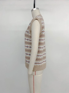 Detailed view of Fair Isle geometric jacquard pattern on a beige knit vest sweater