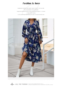 Detail of V-neck floral maxi dress with waist belt and ruffled hem on navy chiffon fabric