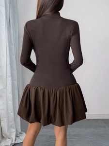 Back view of brown long sleeve mini dress with knit bodice and flared pleated skirt