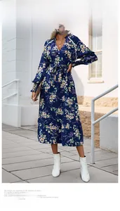 Detailed V-neck and drawstring waist of a navy blue floral midi dress with long sleeves