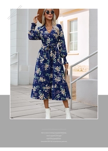 Detail view of floral print maxi dress featuring long lantern sleeves and a V-neckline