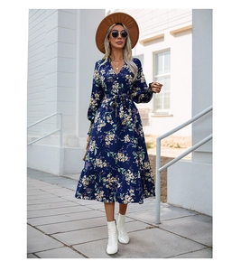 Detail of navy floral V-neck maxi dress with long sleeves and ruffled hem for autumn