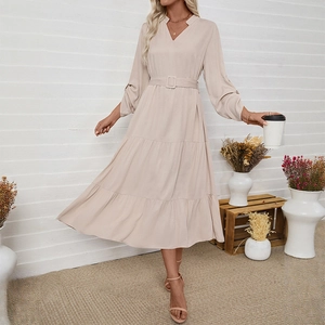 Elegant beige long sleeve midi dress with V-neckline, waist belt, and layered tiered skirt