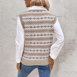 Back view of woman in Fair Isle knit vest with geometric patterns and white shirt