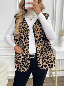 Close-up of leopard print faux fur vest with V-neckline and functional front pockets