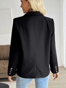 Classic black women's blazer featuring slim-fit back seam and stylish buttoned cuffs