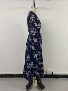 Detail of navy blue floral maxi dress with stand collar and adjustable drawstring waist