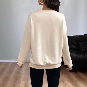 Minimalist beige long sleeve sweatshirt with ribbed cuffs and loose casual back view design