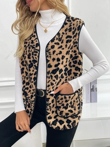 Close-up of leopard print fleece vest with V-neckline and black piping detail