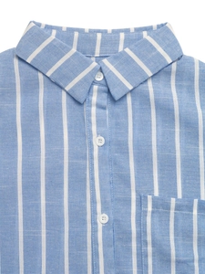 Detail of blue striped shirt collar with white buttons and a chest pocket
