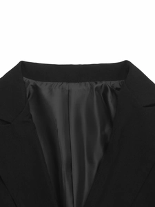Detailed view of women black suit blazer lapel with smooth inner lining texture