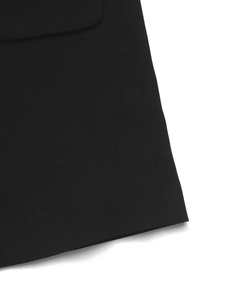 Detail of premium black twill fabric with precision stitching on professional blazer