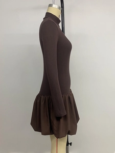 Detail of coffee brown knit long sleeve dress with a stylish bubble hem skirt