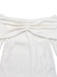 Detail of white off-the-shoulder knitted top showing pleated neckline and ribbed texture