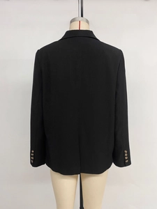 Back view of women's black slim fit blazer with back vent and gold cuff button detail