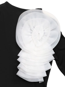 Close-up of a black ribbed knit bodysuit with 3D white organza layered floral detail